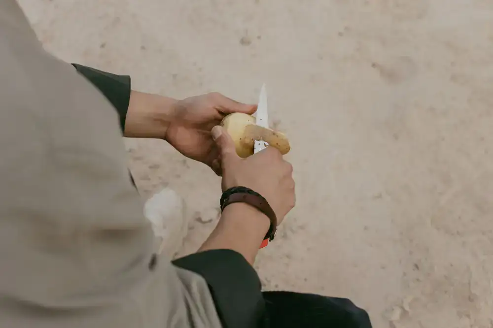 A specialized paring knife meticulously cutting produce