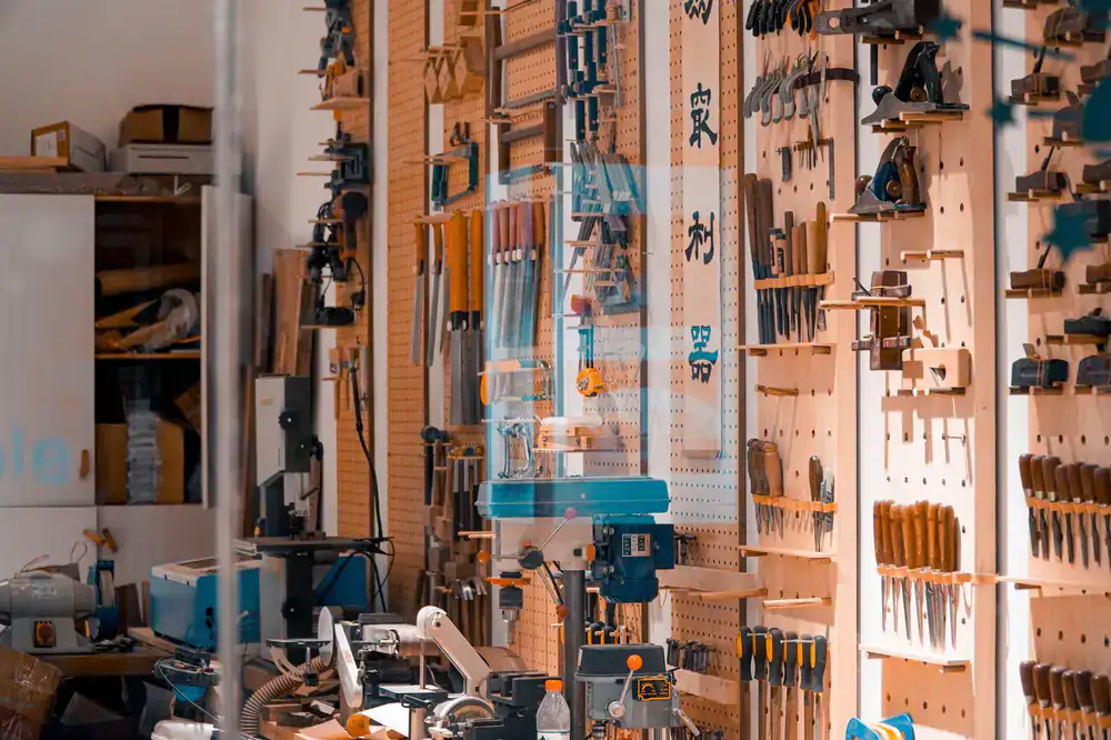 Interior of Edge & Whetstone shop showing neatly arranged display cases and tools